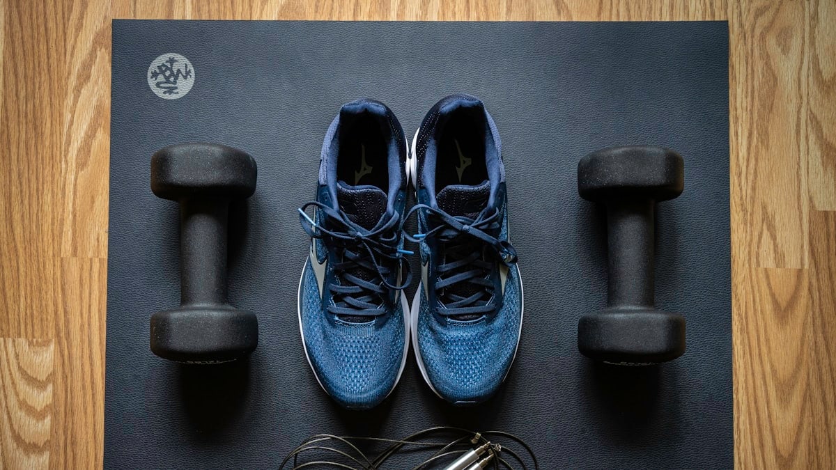 Home gym equipment by ProsourceFit dumbbells and Mizuno sneakers